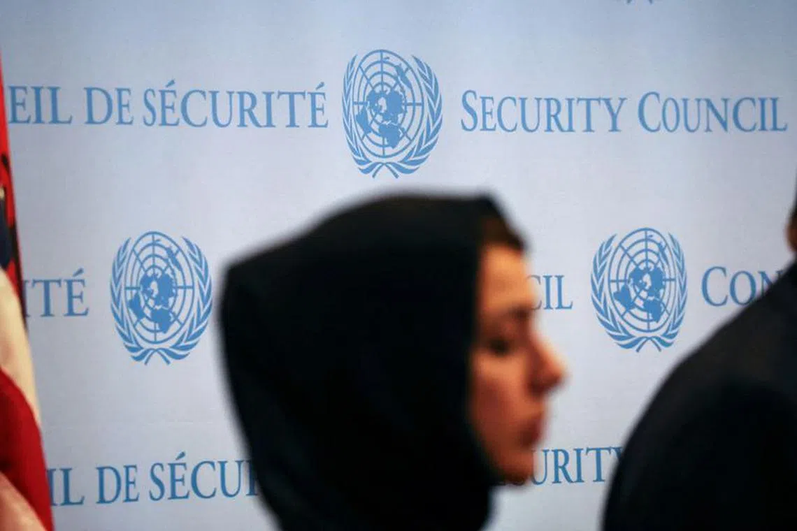 A woman stands during a press conference following the meeting of the Security Council on the conflict between Israel and the Palestinian Islamist group Hamas at U.N. headquarters in New York, U.S., October 24, 2023. REUTERS/Shannon Stapleton