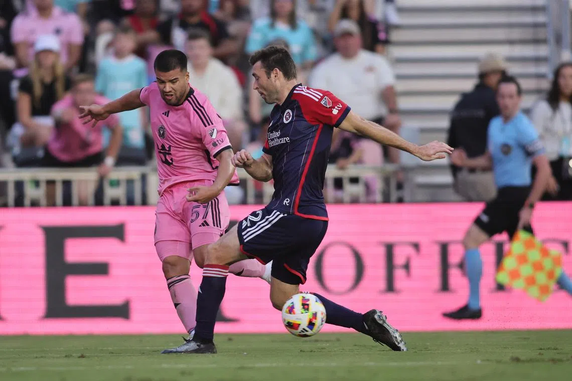 Oct 19, 2024; Fort Lauderdale, Florida, USA;  New England Revolution defender Dave Romney (2) dribbles the ball against Inter Miami CF defender Marcelo Weigandt (57) during the first half at Chase Stadium. Sam Navarro-Imagn Images/File Photo