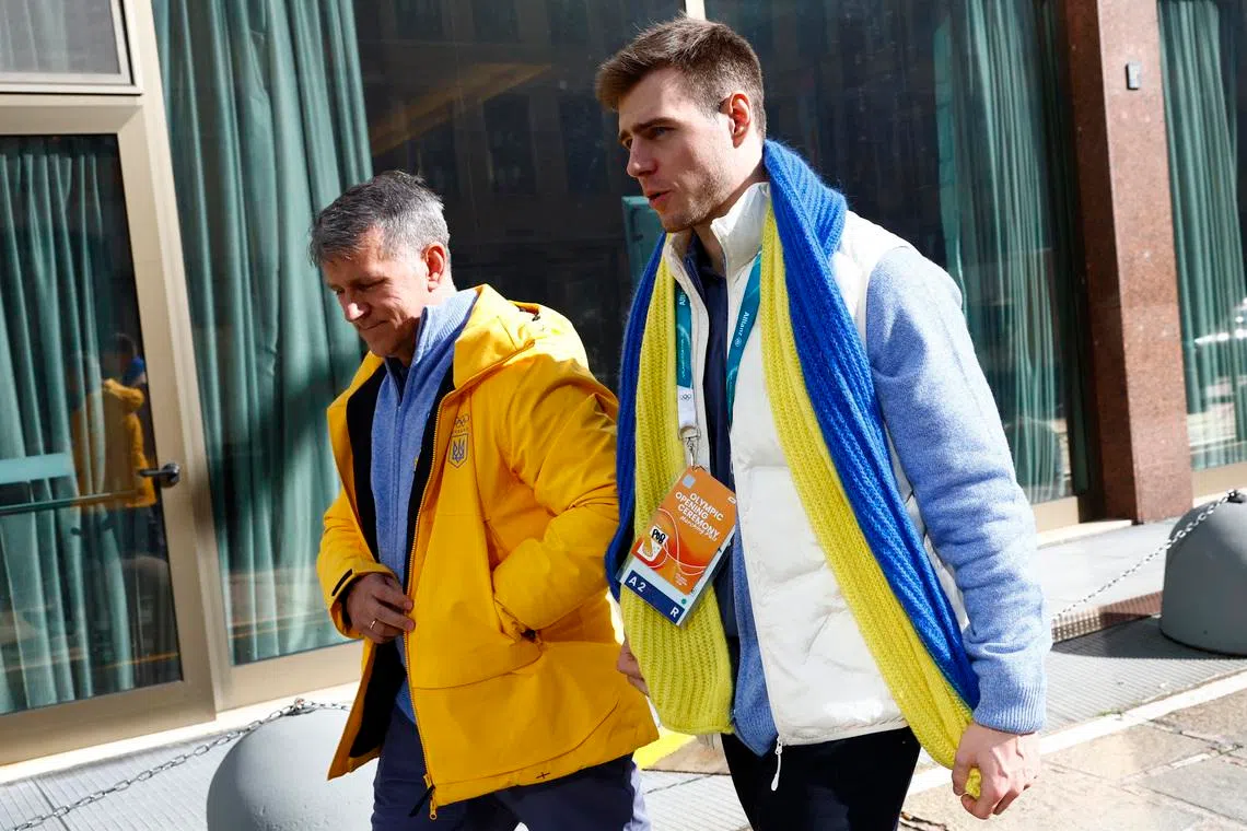 Milano Cortina 2026 Winter Olympics - Skeleton - Vladyslav Heraskevych of Ukraine appears before the Court of Arbitration for Sport - Hilton Milan, Milan, Italy - February 13, 2026 Vladyslav Heraskevych of Ukraine and his father and coach, Mykhailo Heraskevych after appearing before Court of Arbitration for Sport following his disqualification from the Milano Cortina 2026 Winter Olympics for wearing a helmet in tribute to athletes who have died amid Russia's attack on Ukraine REUTERS/Alessandro Garofalo