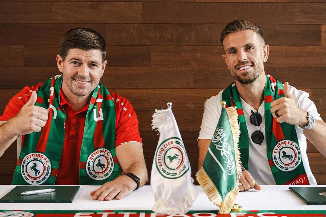 Al-Ettifaq unveil Jordan Henderson (right) to club fans, with coach Steven Gerrard.