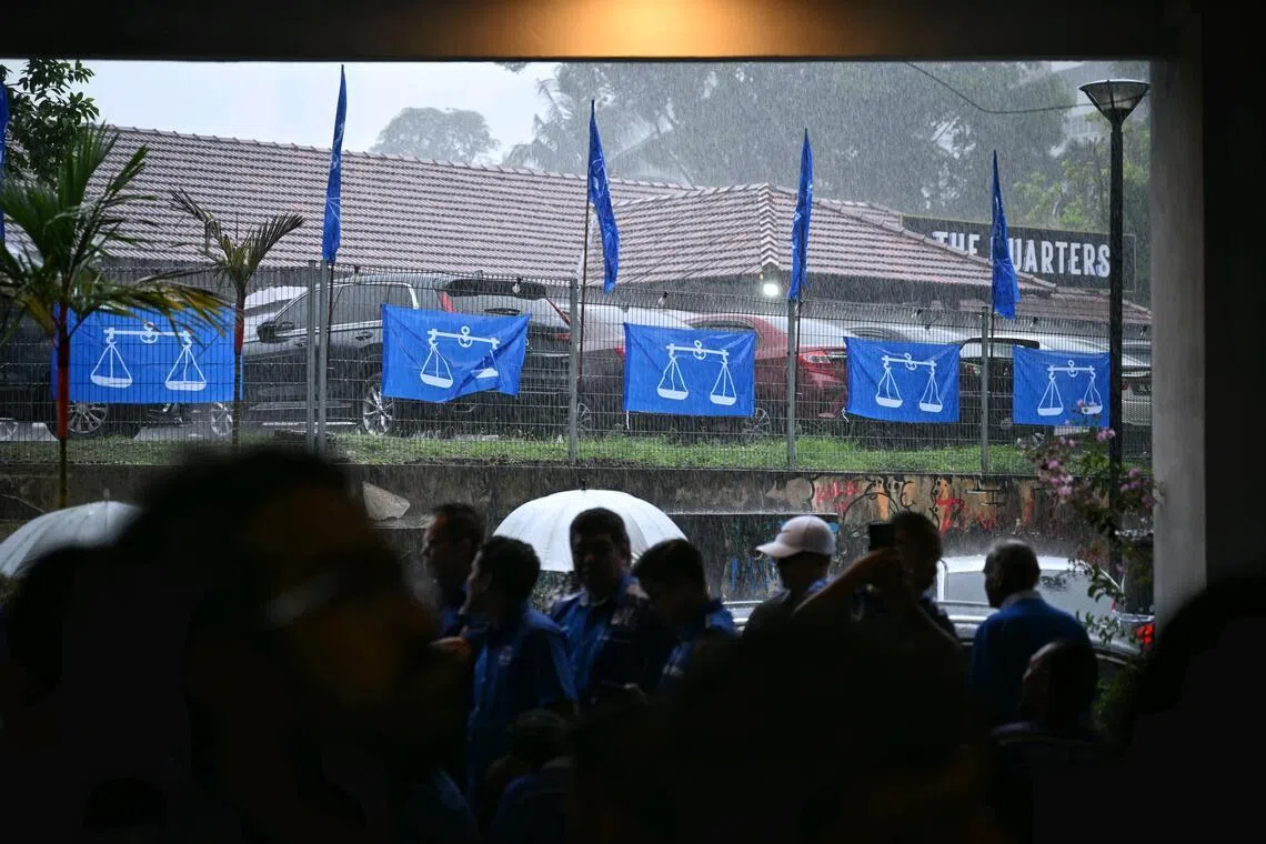 Supporters gather for Barisan Nasional (BN)’s candidate announcement at Johor UMNO Liaison headquarters on June 24.