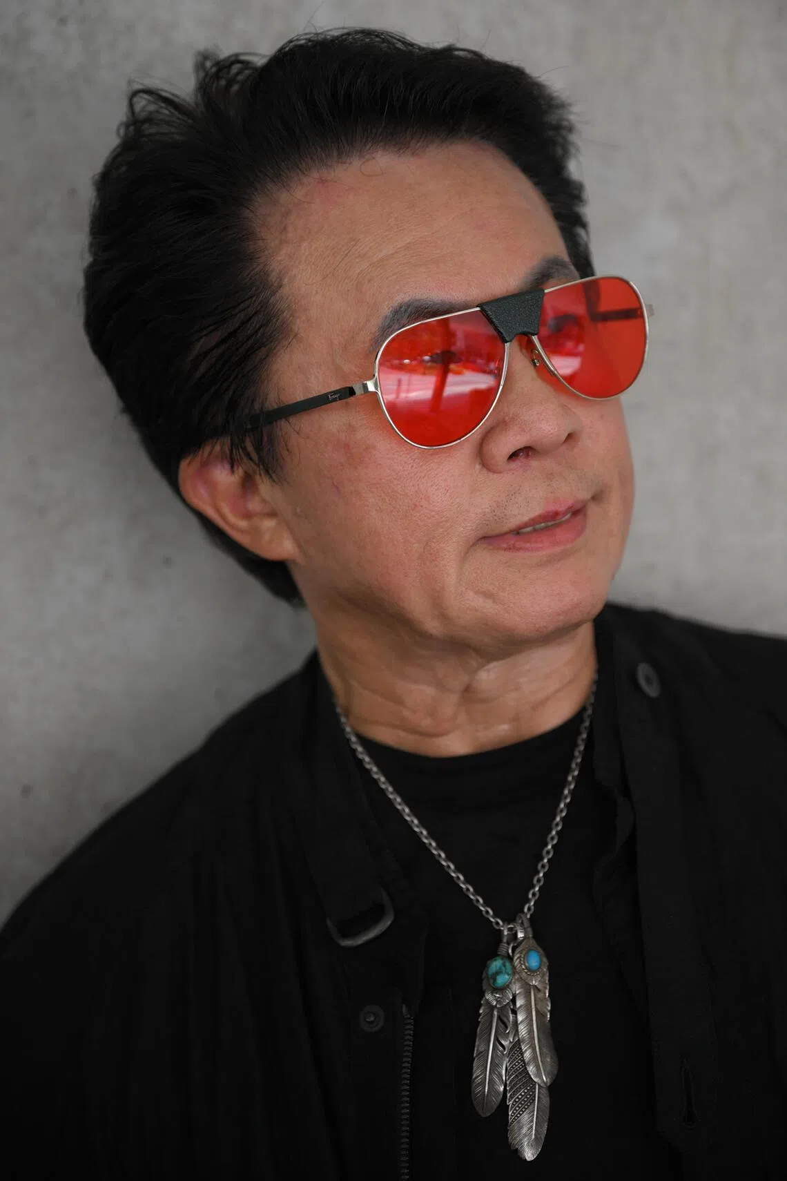 Mr Roger Tan’s statement accessories complete his outfit.
