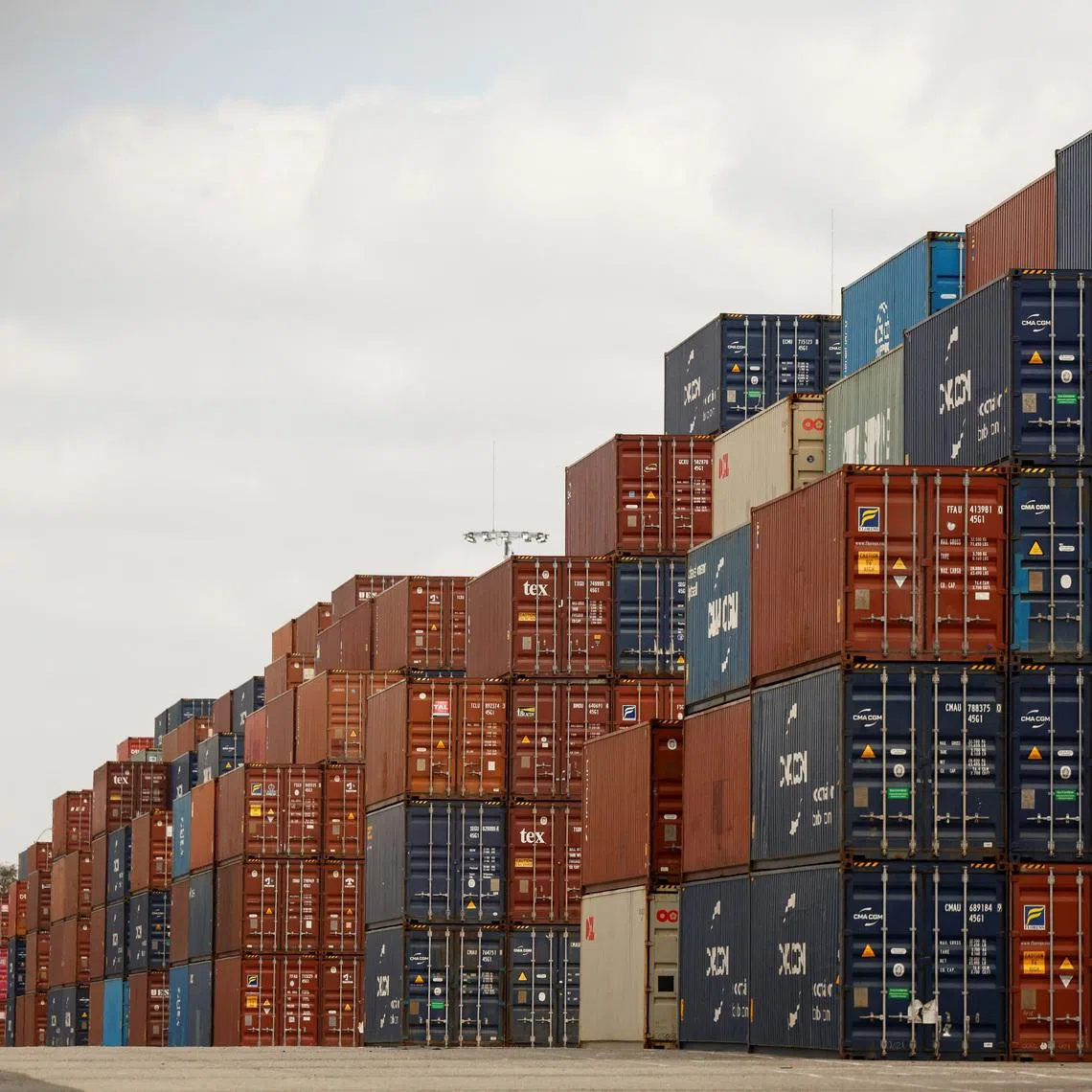 Shipping containers are stacked at the port of Los Angeles in Long Beach, California, U.S., March 10, 2026. REUTERS/Caroline Brehman