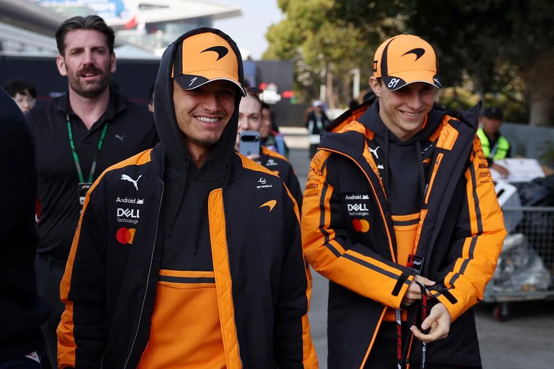 Formula One F1 - Chinese Grand Prix - Shanghai International Circuit, Shanghai, China - March 14, 2026 McLaren's Lando Norris and McLaren's Oscar Piastri arrive ahead of sprint REUTERS/Jakub Porzycki