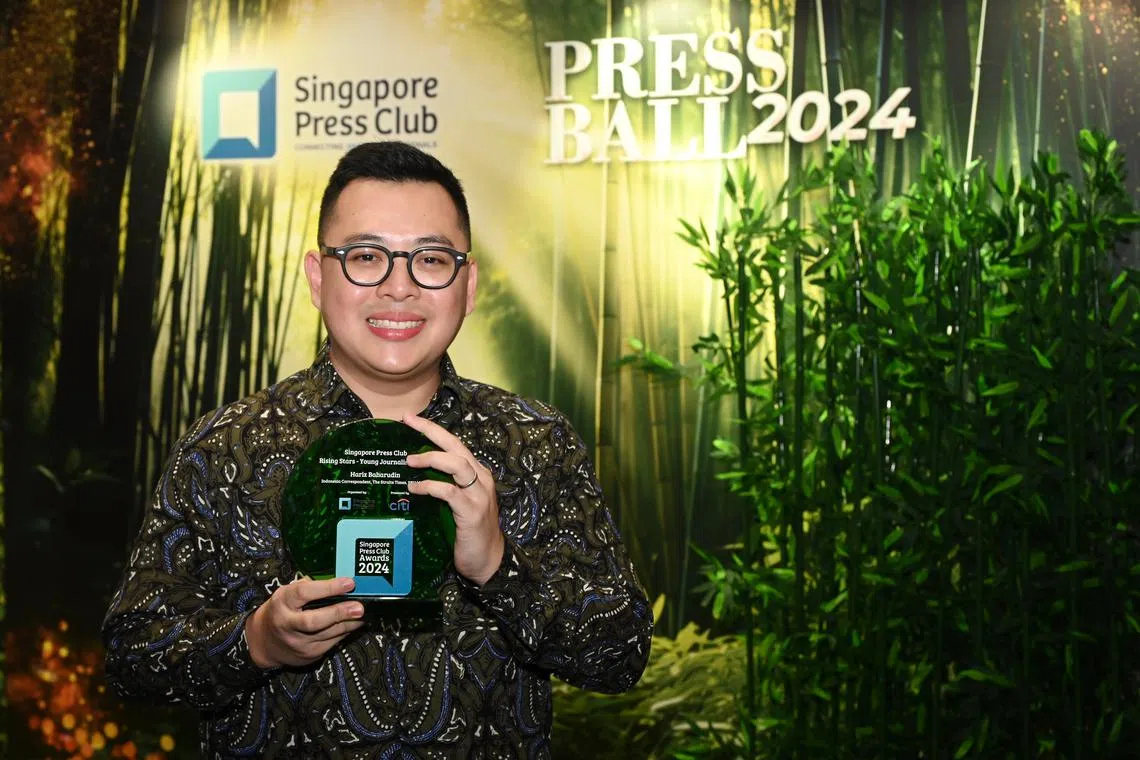 ST's Indonesia correspondent Hariz Baharudin receives the Rising Stars – Young Journalist Award at the Singapore Press Club Awards 2024 on July 13.