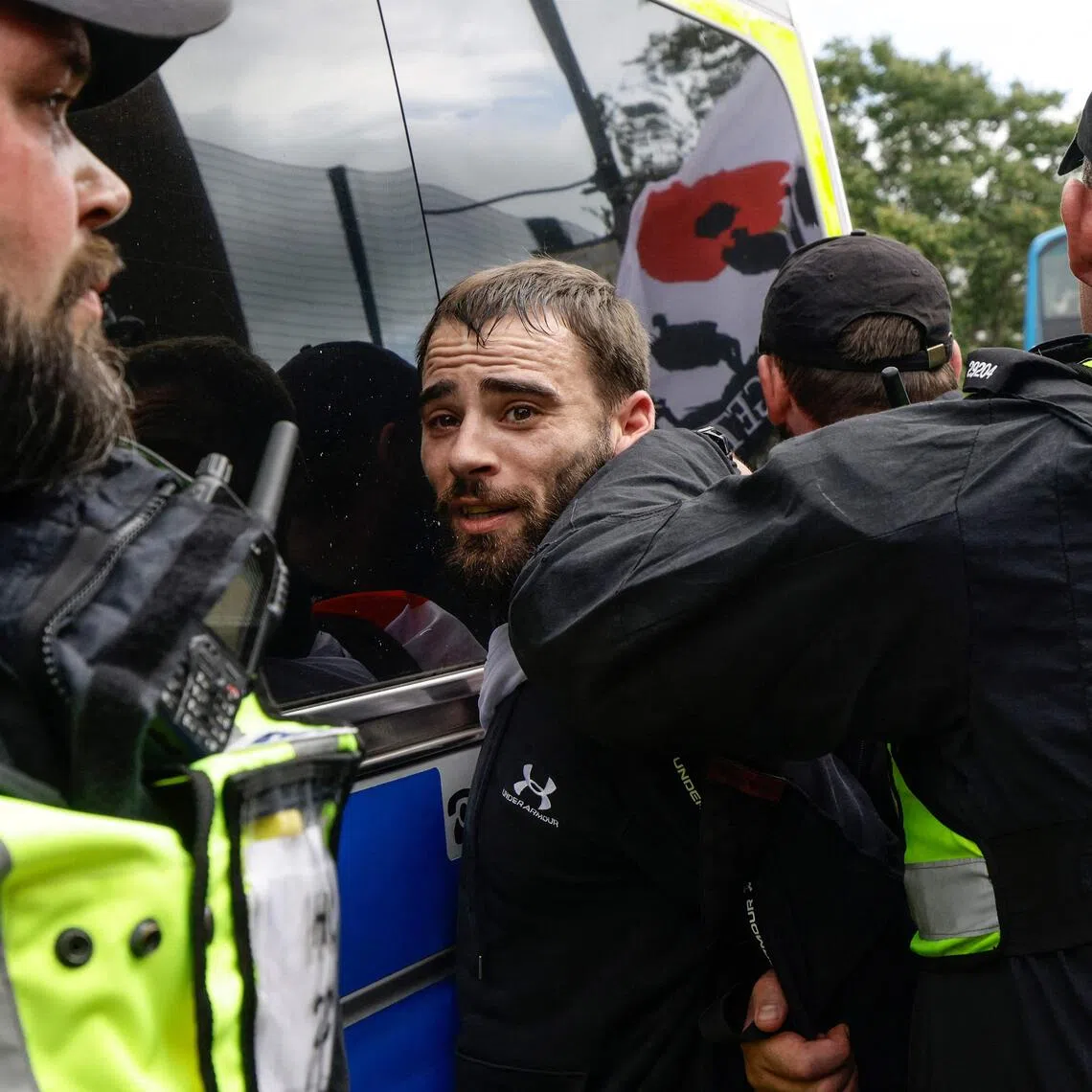 Police arresting an anti-immigration protester in the city of Portsmouth, southern England, on Sept 12.