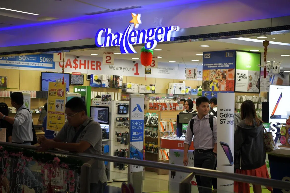 Customers at the Challenger outlet at NEX Mall in Serangoon.