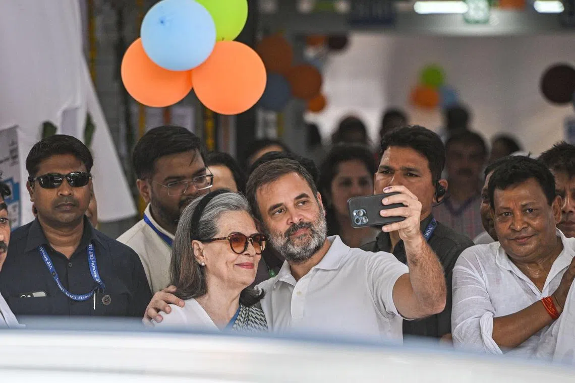 Mr Rahul Gandhi, India's opposition leader, takes a selfie photograph with his mother Sonia Gandhi, former president of the Congress party, at a polling station on May 25. 