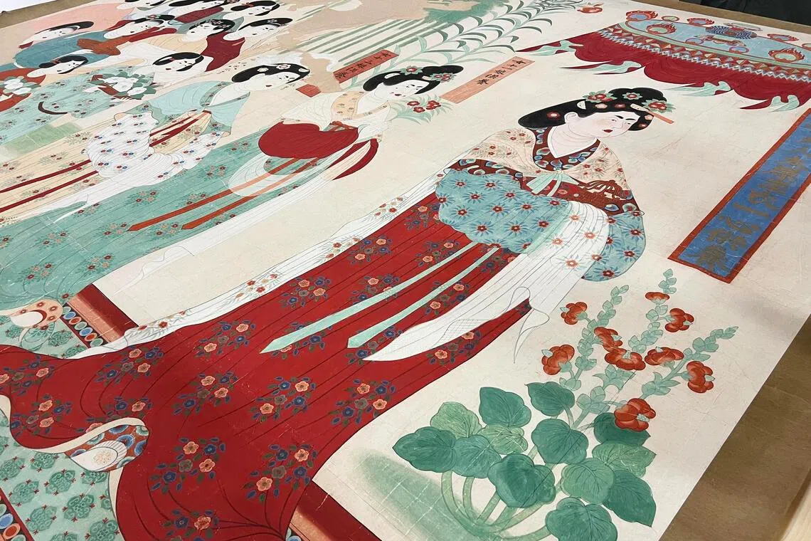 Larger-than-life portraits of patron women show the distinctive use of flower petal paintings or appliques as make-up.