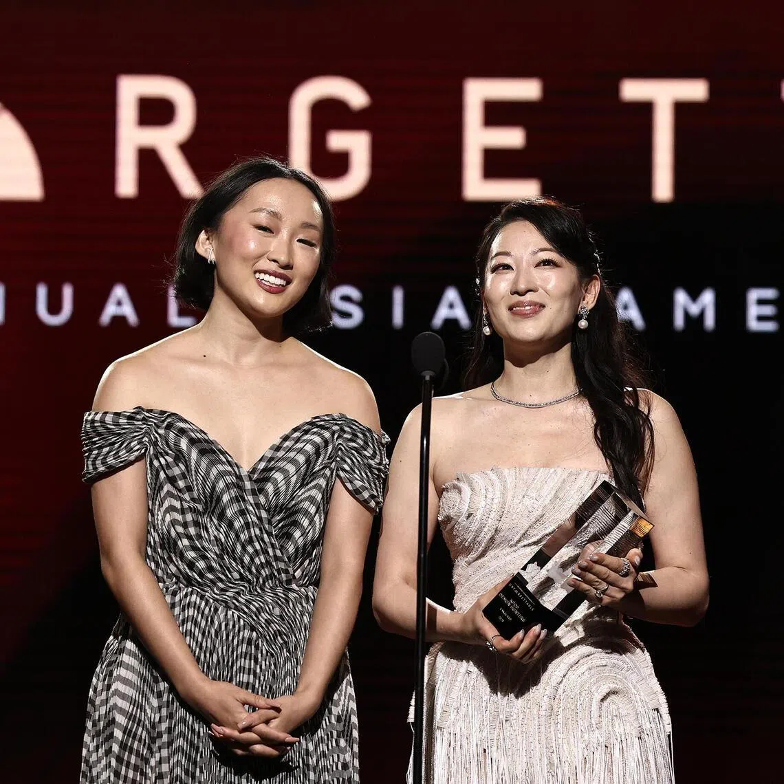 Ji-young Yoo (left) and Arden Cho accepted the Vanguard Award on behalf of KPop Demon Hunters at the Unforgettable Awards in Los Angeles on March 7, 2026.