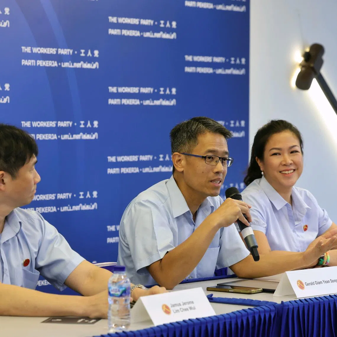 The Workers' Party's incumbent Aljunied GRC MP Gerald Giam (centre), flanked by incumbent Sengkang GRC MPs Jamus Lim (left) and He Ting Ru, speaking at launch of the party's election manifesto on April 17.