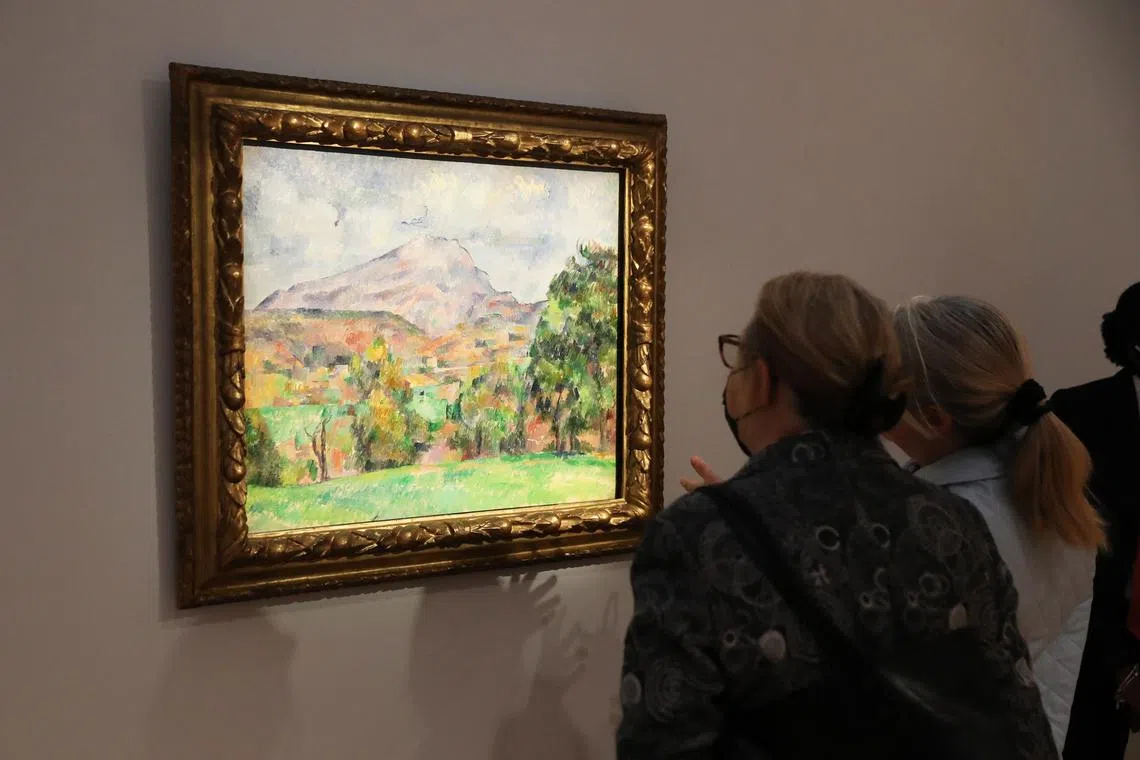 People viewing La Montagne Sainte-Victoire by French artist Paul Cezanne, estimated in excess of US$120 million, during a preview of works belonging to late Microsoft co-founder Paul Allen.