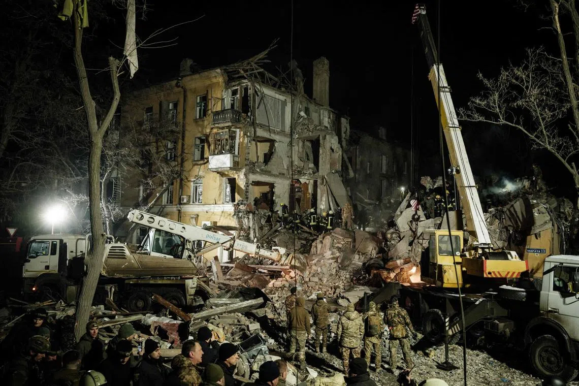 Rescuers searching for survivors at a destroyed apartment building hit by a rocket in Kramatorsk, Ukraine, on Feb 1, 2023.