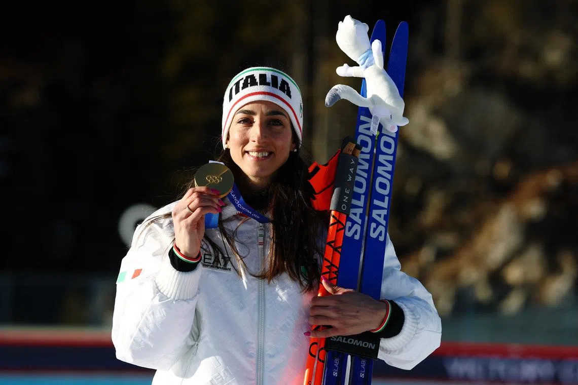 Milano Cortina 2026 Olympics - Biathlon - Women's 10km Pursuit Victory Ceremony - Anterselva Biathlon Arena, South Tyrol, Italy - February 15, 2026. Gold medallist Lisa Vittozzi of Italy celebrates on the podium during the Women's 10km Pursuit Victory Ceremony. REUTERS/Matthew Childs