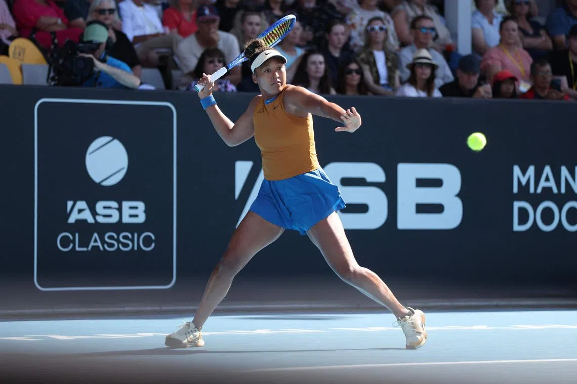 Naomi Osaka of Japan hits a return against Clara Tauson of Denmark during their women's singles final match at the WTA Auckland Classic.