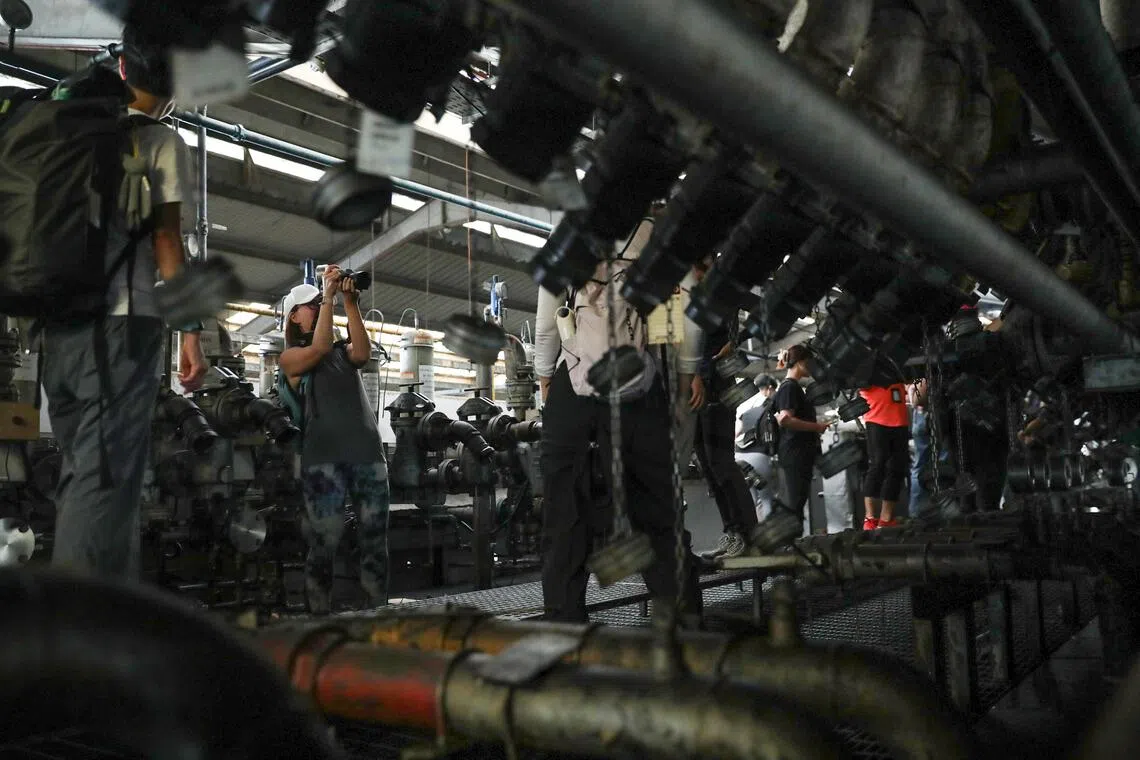 Metal pipes and valves in a factory. 