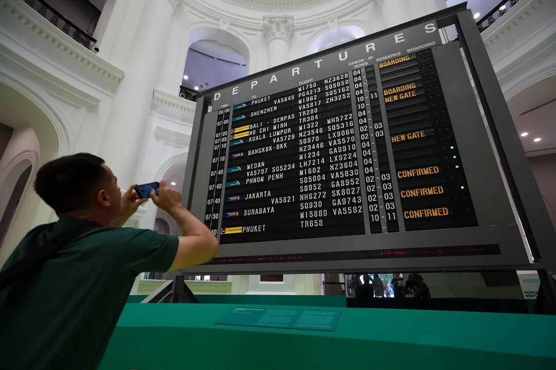 ST20230522_202346884563/mmmuseum22/Ryan Chiong The retired Changi Airport Terminal 2 flight information display flip board, now on display at the National Museum of Singapore’s entrance. It is part of the new museum exhibition named “Now Boarding”, seen at a media preview on May 22, 2023.