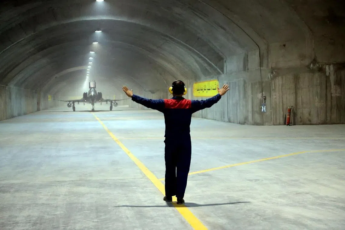 A picture provided by the Iranian Army Office shows a fighter jet during the unveiling of Iran's first underground military air base in an undisclosed location.  