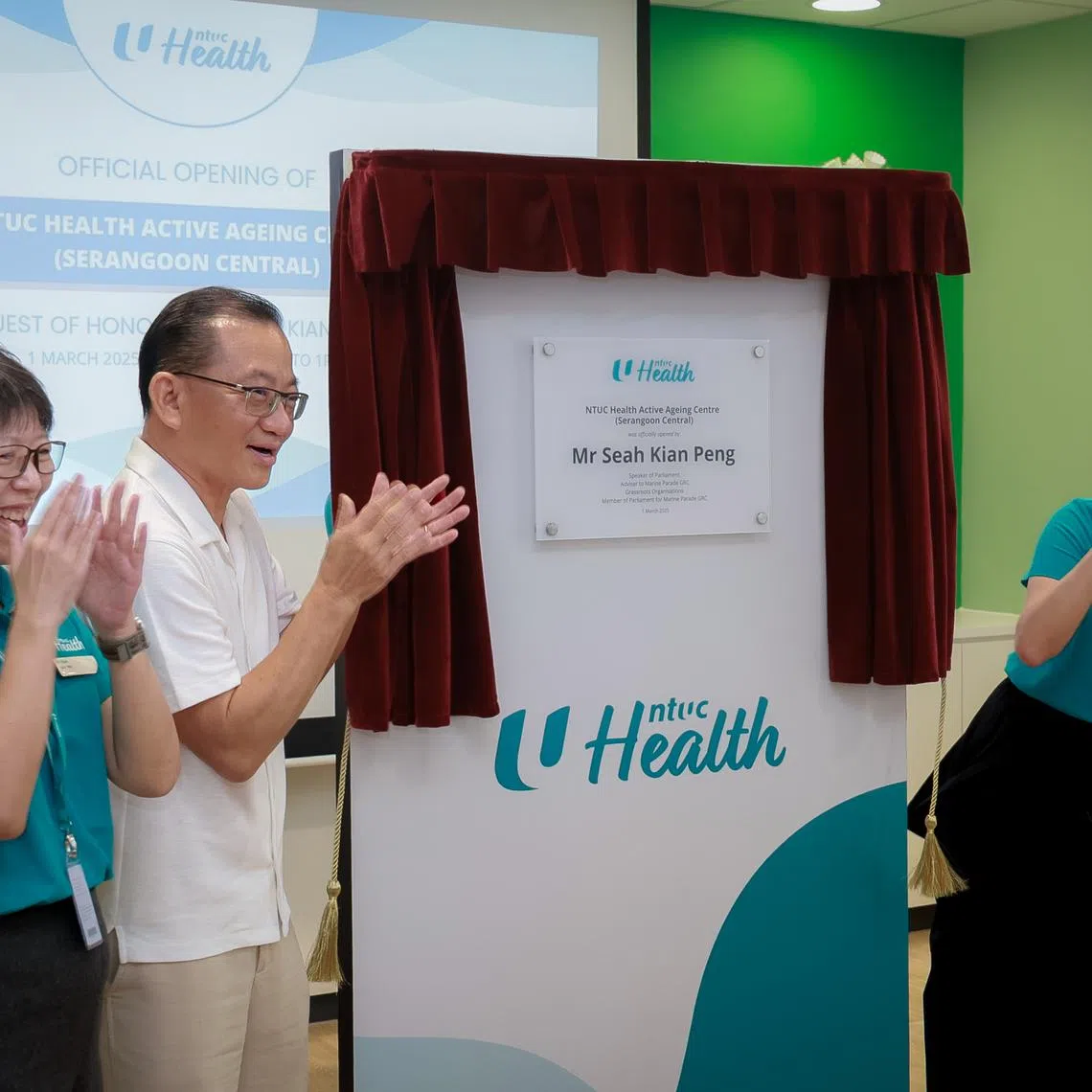 (From left) Head of NTUC Health Active Aging Centres Lily Neo, Speaker of Parliament and Adviser to Marine Parade GRC Grassroots Organisations Seah Kian Peng and NTUC Health CEO Chan Su Yee unveiling a plaque for the official opening of NTUC Health's Active Ageing Centre.
