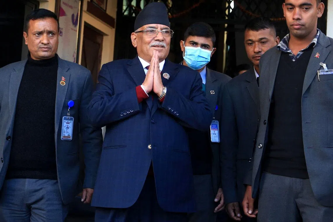 In this photo taken on Dec 25, 2022, Nepal's former guerrilla leader Pushpa Kamal Dahal gestures to media representatives as he leaves for the president's office to claim majority for his appointment as the new prime minister of Nepal. 