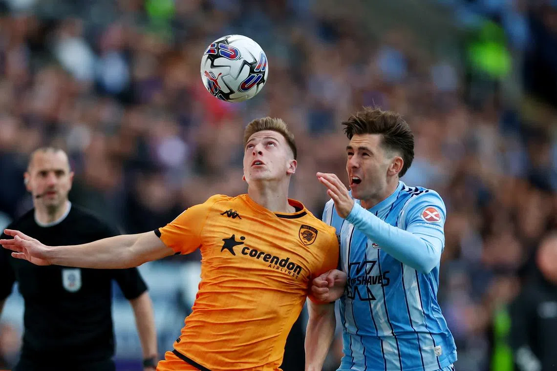 FILE PHOTO: Soccer Football - Championship - Coventry City v Hull City - Coventry Building Society Arena, Coventry, Britain - April 24, 2024 Coventry City's Luis Binks in action with Hull City's Liam Delap  Action Images/Matthew Childs/File Photo