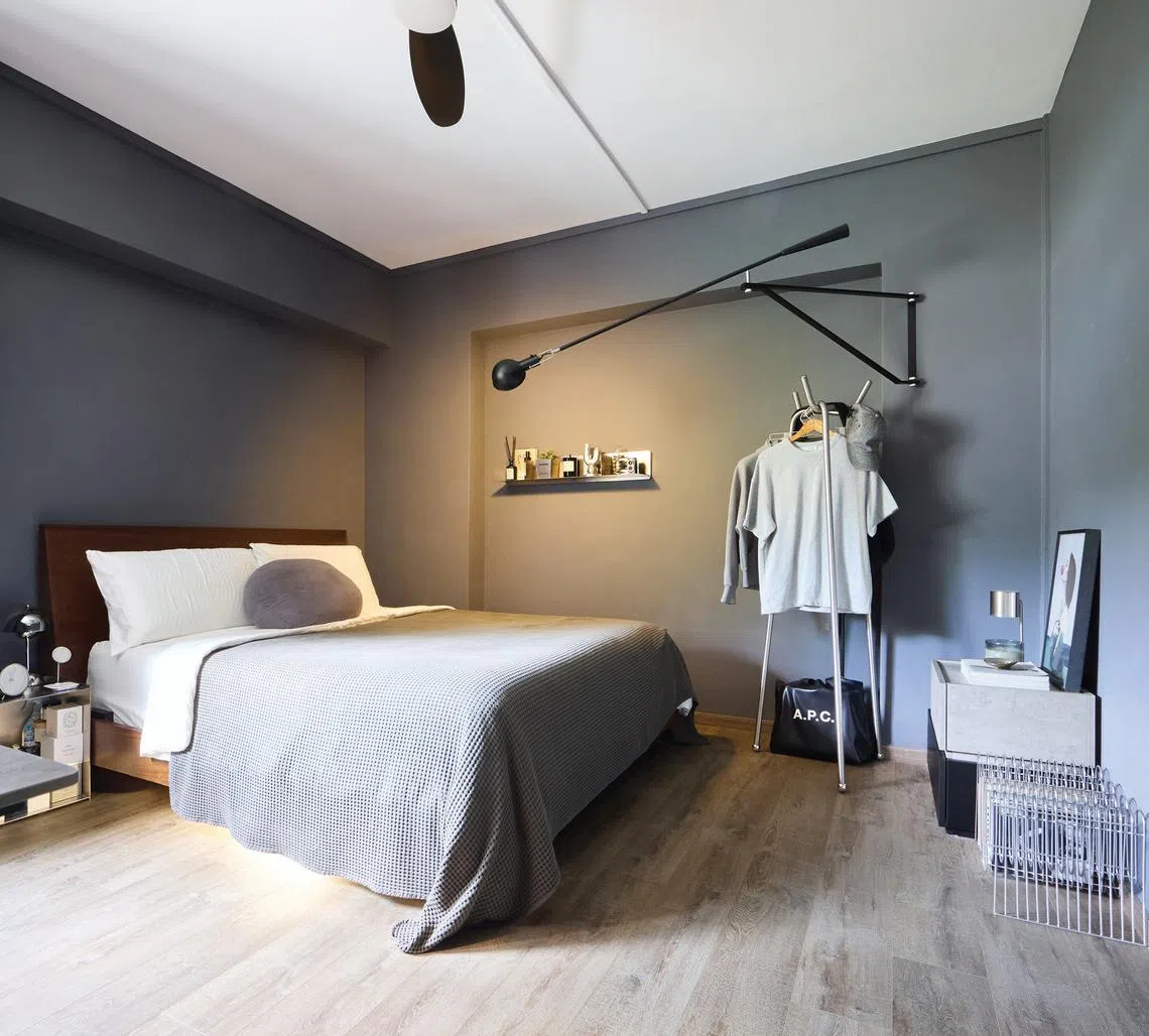 The master bedroom is decked out in shades of grey.