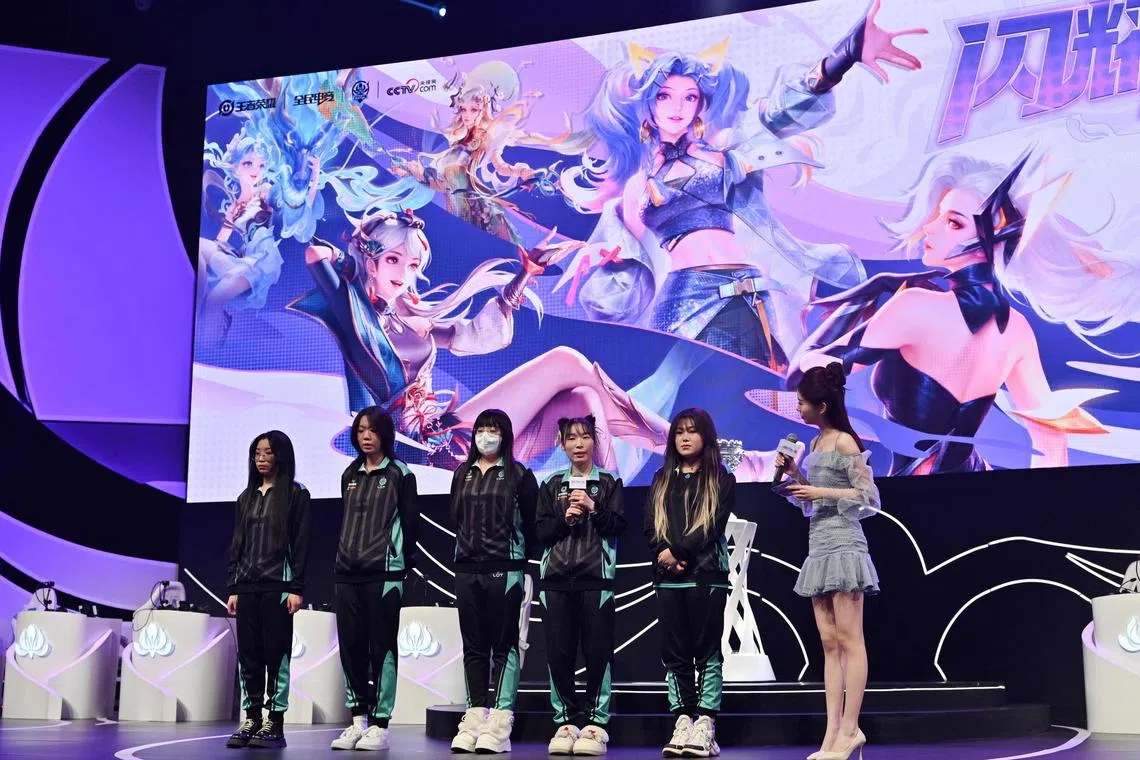 Female gamers being interviewed after competing in a women's E-sport event in Beijing. For women E-sports players in China, mastering the game is only the first hurdle to carving out a space for themselves in the male-dominated field.