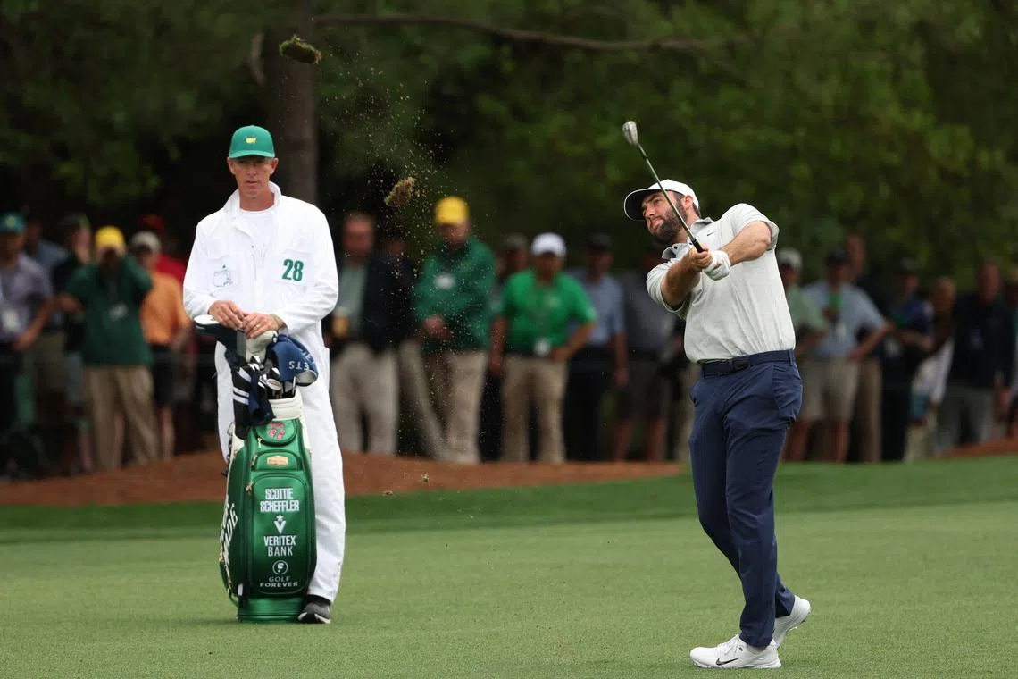 Golf - The Masters - Augusta National Golf Club, Augusta, Georgia, U.S. - April 11, 2024 Scottie Scheffler of the U.S. hits his approach on the 1st hole during the first round REUTERS/Mike Segar