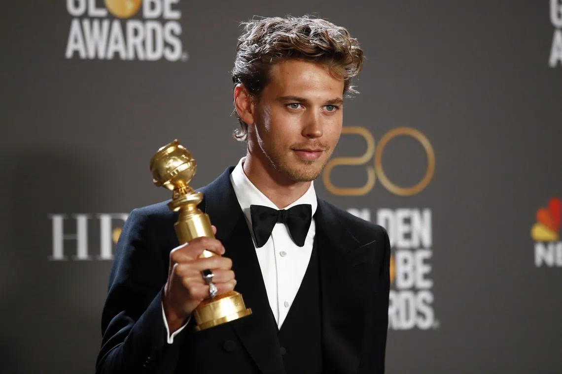 Austin Butler poses with the award for Best Actor in a Drama Motion Picture.