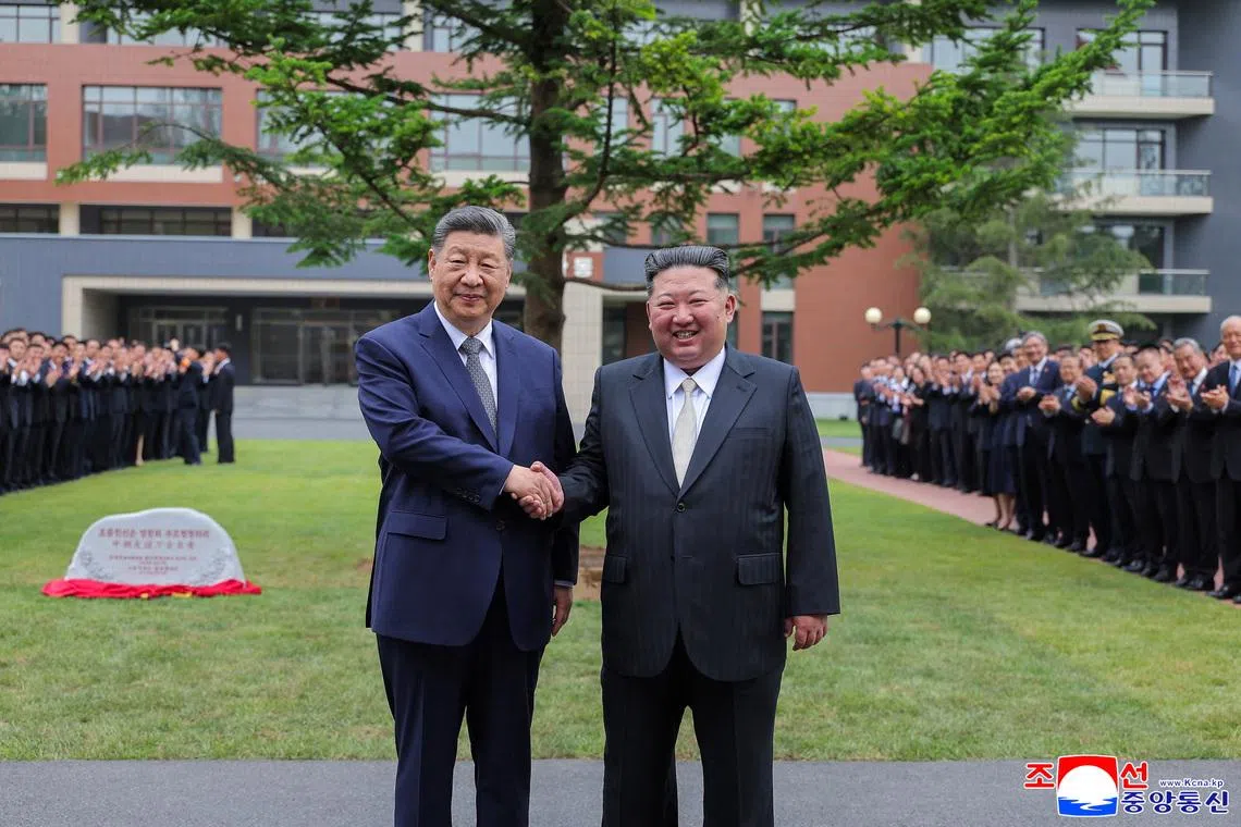 Chinese President Xi Jinping and North Korean leader Kim Jong Un pose for a picture as they visit the Central Cadres Training School of the Workers' Party, in Pyongyang, North Korea, June 9, 2026. KCNA via REUTERS