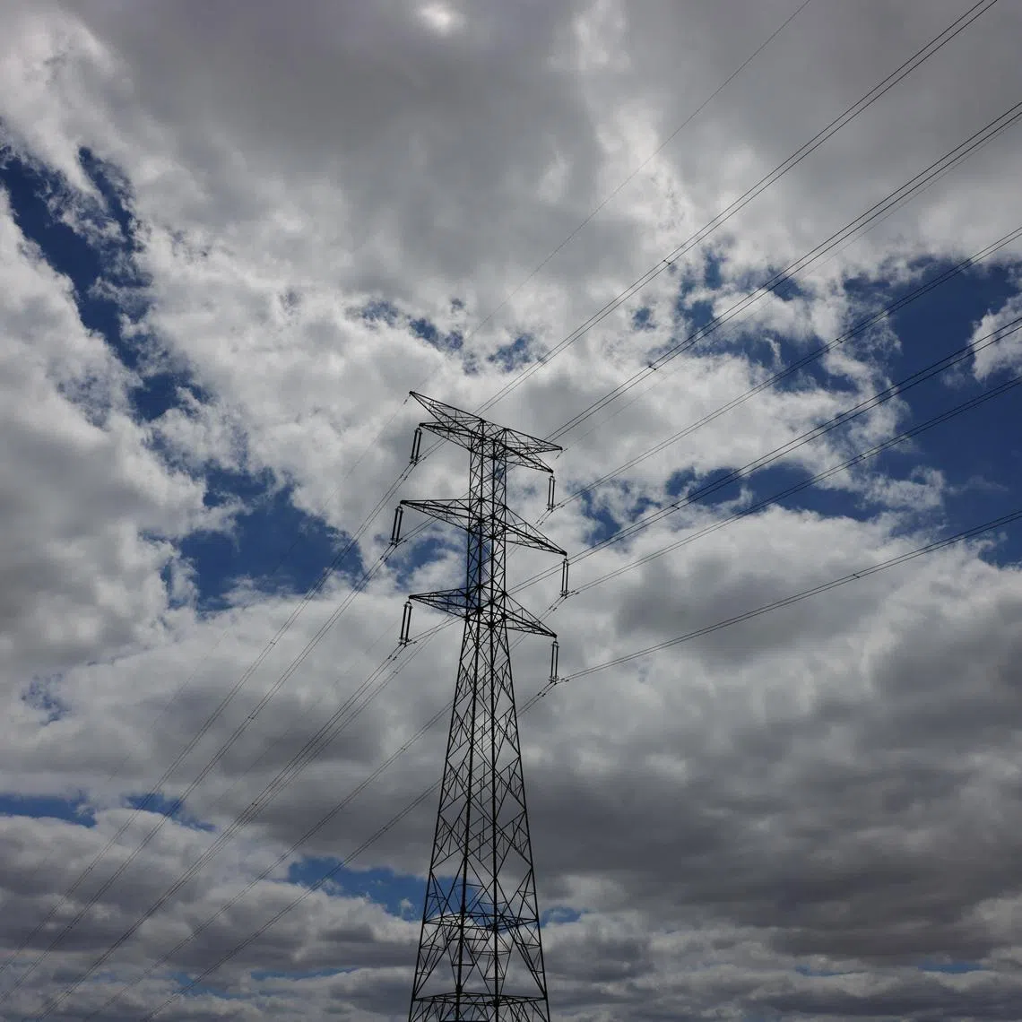 An electrical power pylon of high-tension electricity is pictured in a field, near Casares, Spain, July 12, 2025. REUTERS/Jon Nazca
