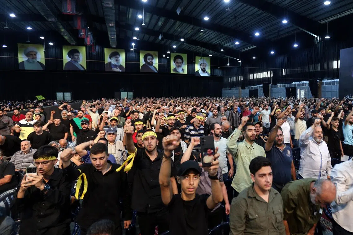 Hezbollah supporters mark the first anniversary of the killing of senior commander Ibrahim Aqil, who died in an Israeli air strike on Sept 20, 2024.