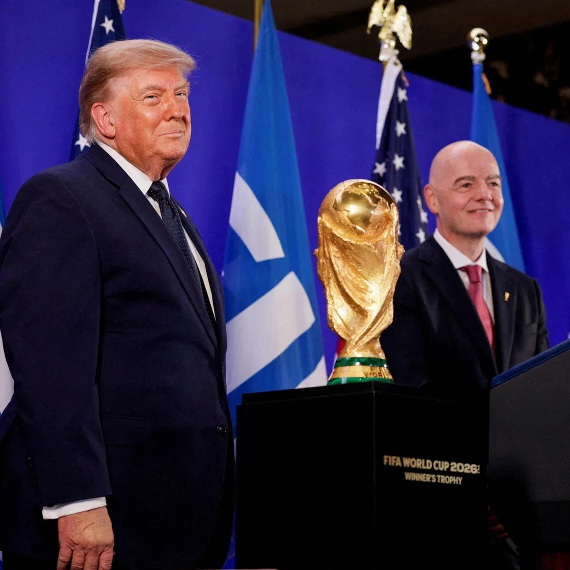 US President Donald Trump (left) and FIFA President Gianni Infantino attend a FIFA reception at Trump Tower on July 17.