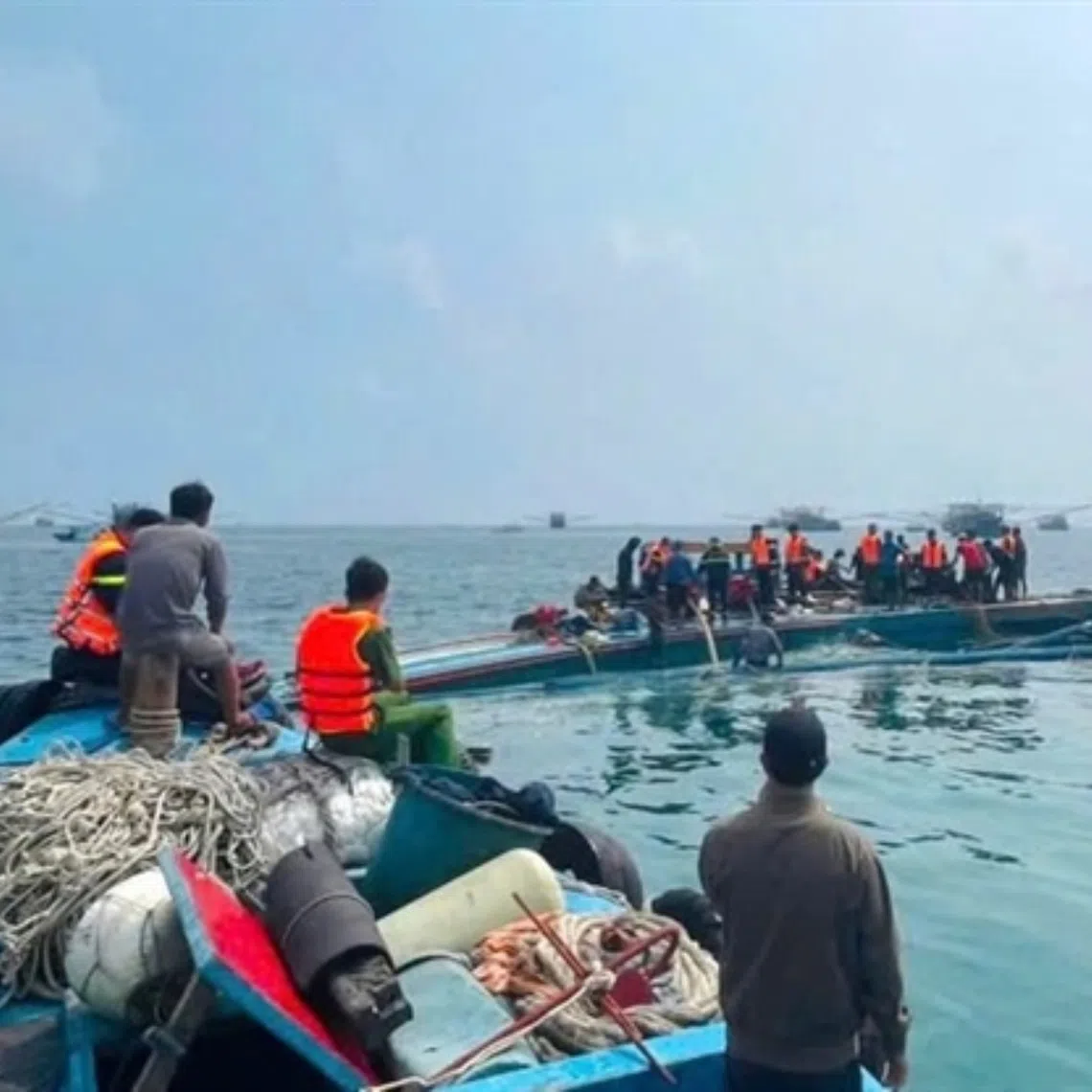 Authorities and local fishermen search for a worker missing after a fishing boat capsized near Phu Quy Island on Sept 15.