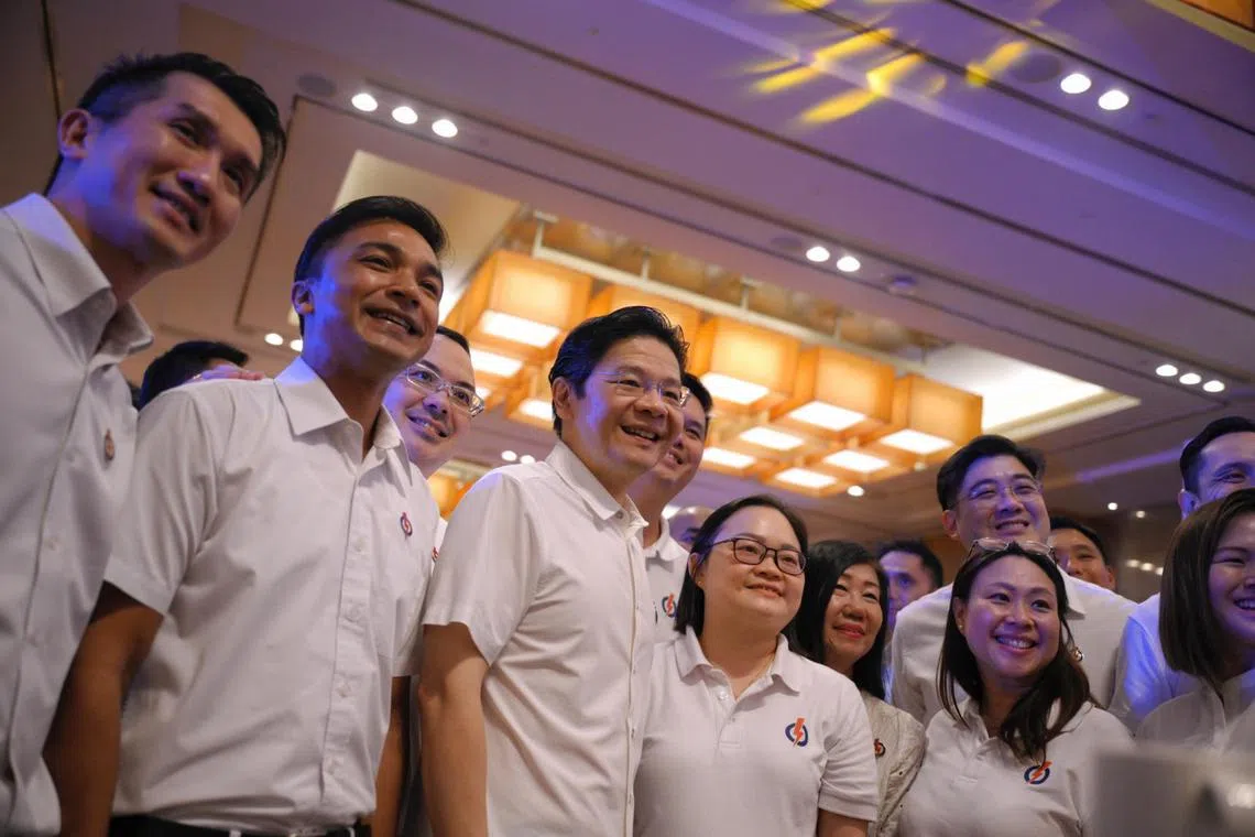 Prime Minister Lawrence Wong (centre) greets guests at #refreshPAP held at the Sands Expo and Convention Centre on June 8, 2024.