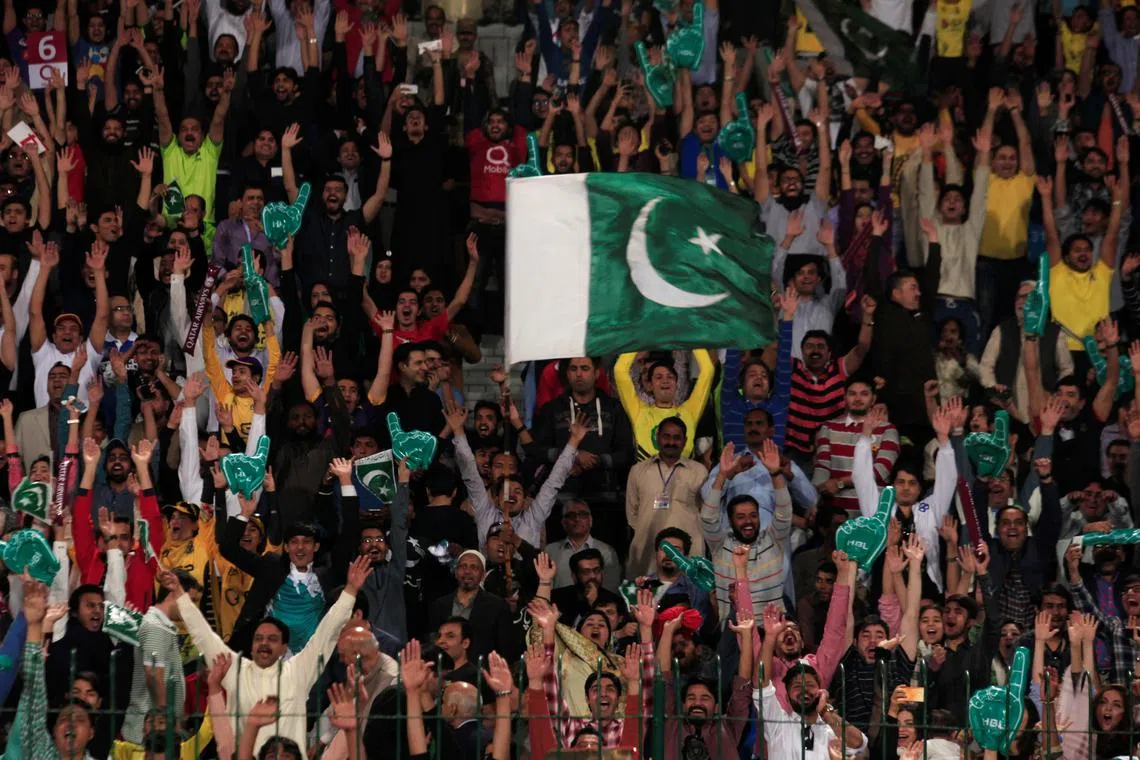 FILE PHOTO: Pakistani spectators cheer during a hugely anticipated final of its domestic cricket league, Pakistan Super League (PSL) at the Gaddafi Cricket Stadium in Lahore, Pakistan, March 5, 2017.   REUTERS/Faisal Mahmood/File Photo