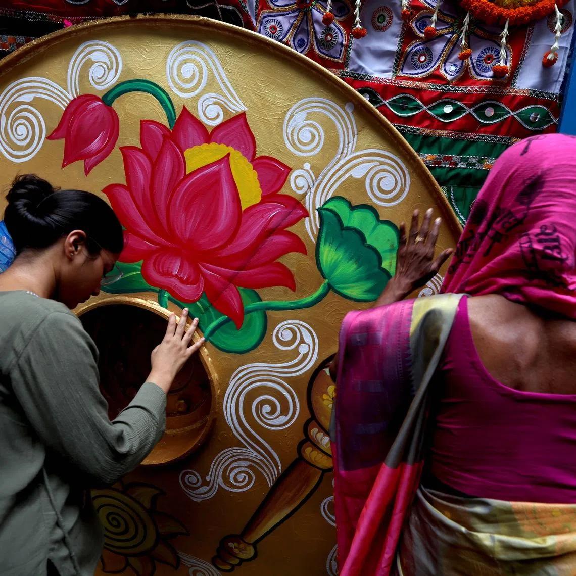 Indian devotees greet a holy chariot during the annual Jagannath Rath Yatra festival in Kolkata, India, on July 16.