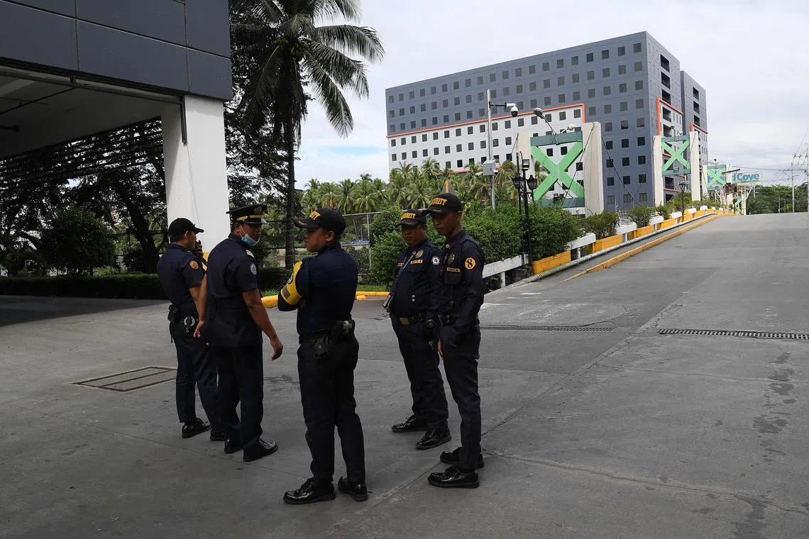 Authorities raided a building and found workers allegedly engaged in online scam operations targeting victims abroad.