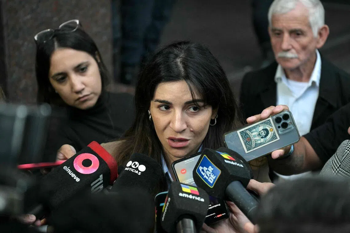 Gianinna Maradona, daughter of Argentine football legend Diego Maradona, speaks to the media outside the court for a trial hearing on her father's death in San Isidro.