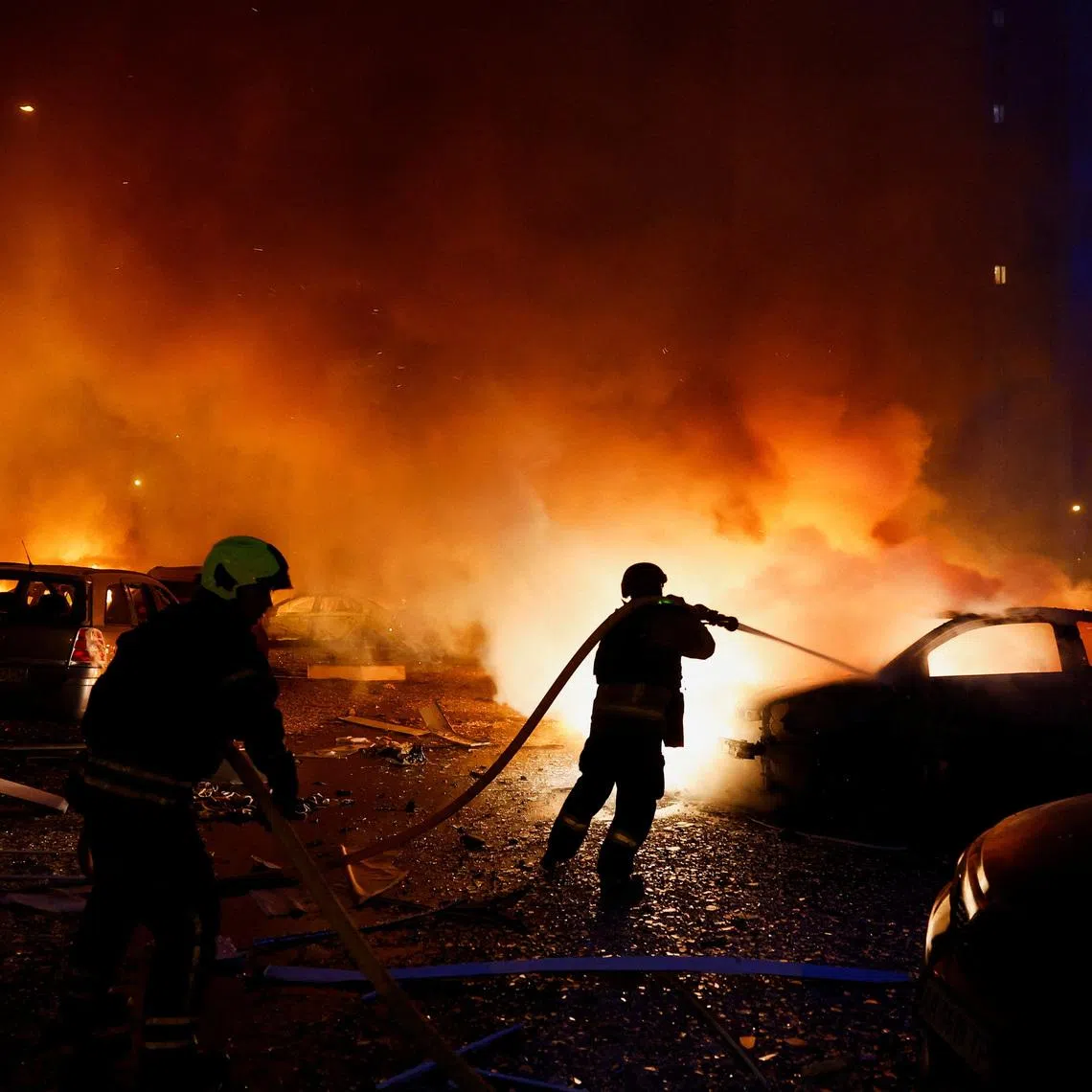 A firefighter at the site of residential apartment buildings, which were heavily damaged during Russian missile and drone strikes, in Kyiv, Ukraine, on July 6.