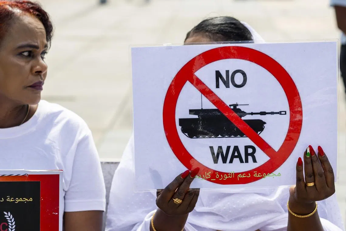 Women take part in a demonstration on the opening day of talks aimed at a cessation of hostilities in Sudan on Place des Nations in front of the European headquarters of the United Nations, in Geneva, Switzerland, on Aug 14, 2024.
