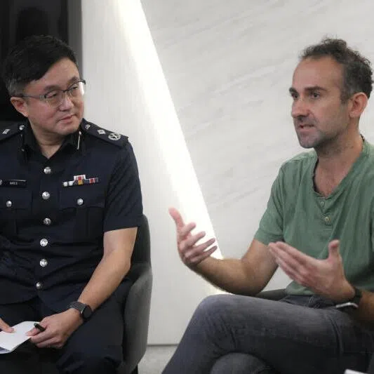 Online Criminal Harms Act Office director Marc E (left) and Mr Gijs Verheijke, Carousell's director of trust and customer experience, speaking to the press on Feb 19.