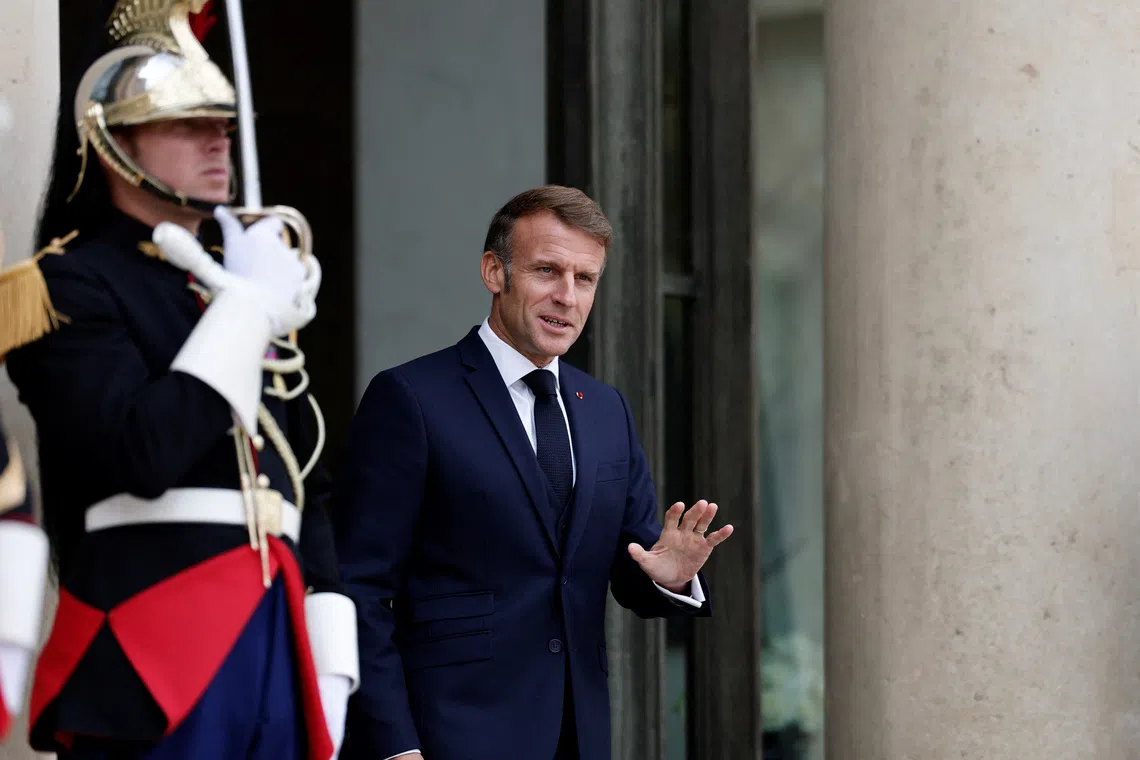 French President Emmanuel Macron waves to journalists at the Elysee Palace in Paris, France, September 16, 2025. REUTERS/Benoit Tessier