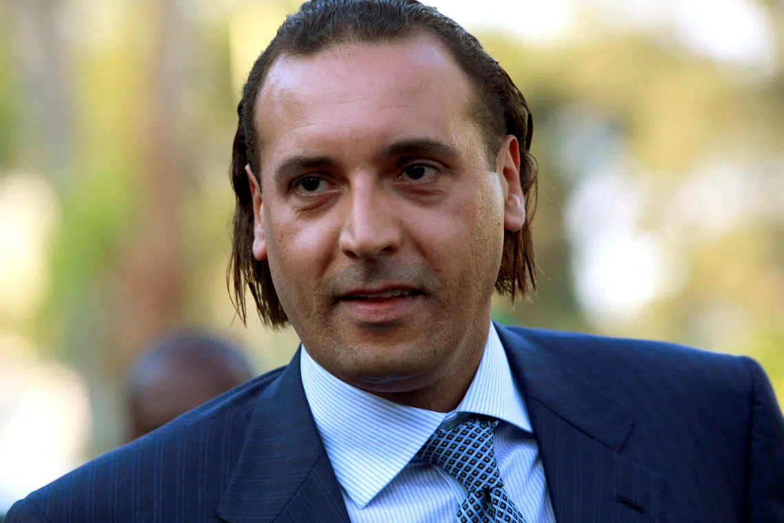 FILE PHOTO: Hannibal Gaddafi, son of Libyan leader Muammar Gaddafi, attends the signing agreement ceremony between Libya's Shipping Corporation and STX Europe to build a cruise ship, in Tripoli June 30, 2010.  REUTERS/Ismail Zitouny/File Photo