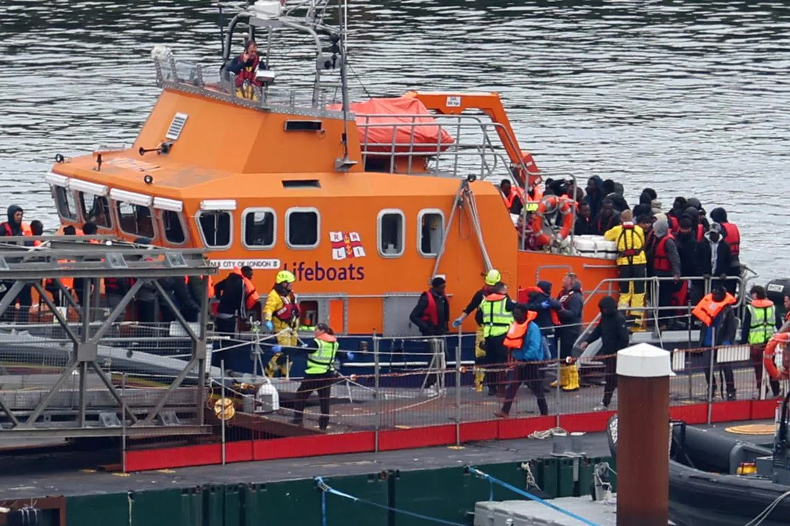 People thought to be migrants disembarking from a lifeboat at Britain's Port of Dover, on April 23, 2024.