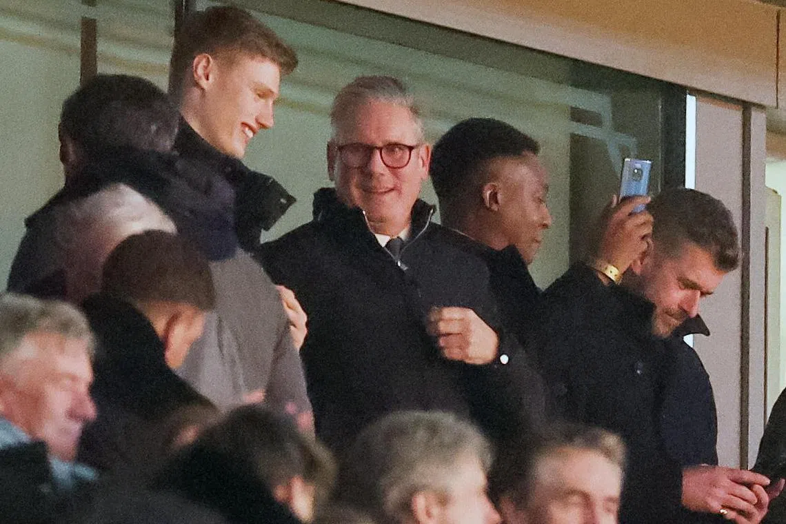 British Prime Minister and Arsenal fan Keir Starmer (centre left) watching Arsenal play Manchester United on Dec 4.