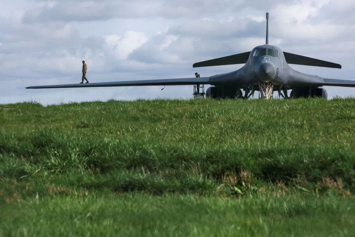 A member of the United States Air Force walking on a wing of a USAF B-1B bomber at RAF Fairford airbase, which hosts United States Air Force (USAF) personnel, amid the US-Israeli conflict with Iran, in Fairford, Gloucestershire, Britain, March 10.