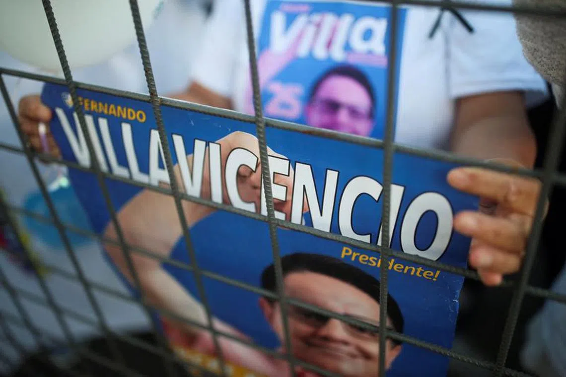 FILE PHOTO: A supporter holds a poster of slain presidential candidate Fernando Villavicencio on the day of the closing campaign rally of Ecuadorean presidential candidate Christian Zurita, who is replacing Villavicencio, in Quito, Ecuador, August 17, 2023. REUTERS/Henry Romero/File Photo