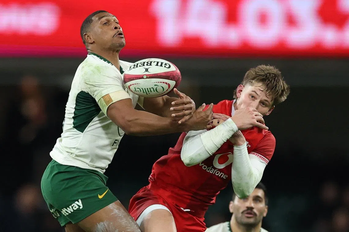 Rugby Union - Autumn Internationals - Wales v South Africa - Principality Stadium, Cardiff, Wales, Britain - November 29, 2025 South Africa's Damian Willemse in action with Wales' Ellis Mee Action Images via Reuters/Andrew Boyers