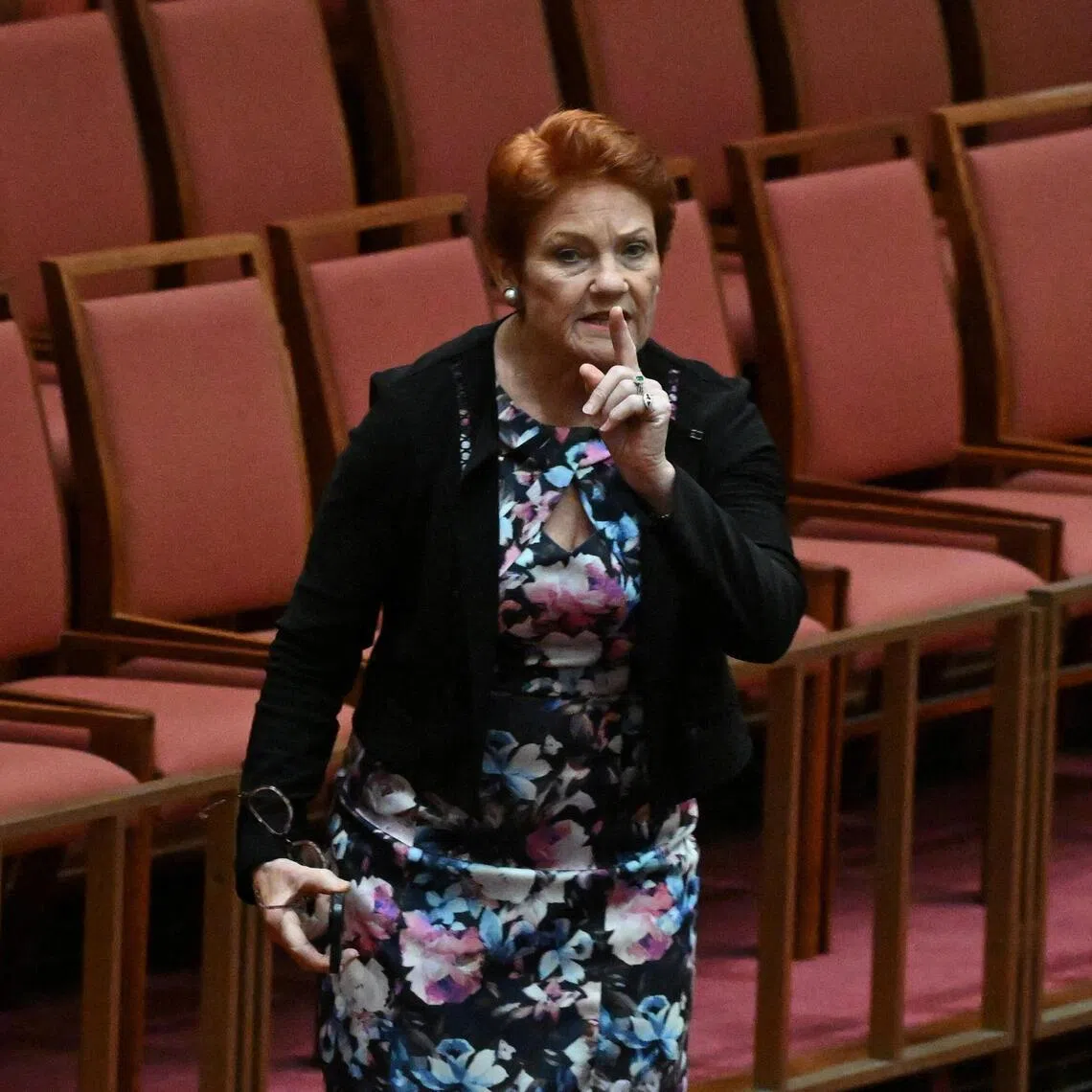 One Nation leader Pauline Hanson walks out during debate on a censure motion in the Senate chamber at Parliament House in Canberra, Australia, on March 2.